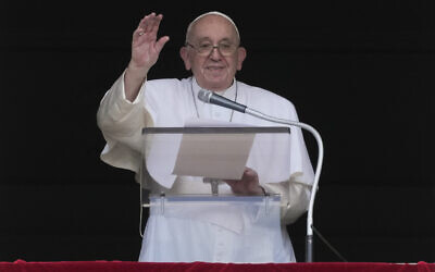 Pope Francis delivers his blessing as he recites the Angelus noon prayer from the window of his studio overlooking St.Peter's Square, at the Vatican, September 11, 2022. (AP Photo/Andrew Medichini)