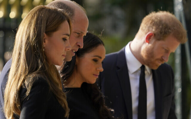 Britain's Prince William and Kate, Princess of Wales, left, and Britain's Prince Harry and Meghan, Duchess of Sussex view the floral tributes for the late Queen Elizabeth II outside Windsor Castle, in Windsor, England, Sept. 10, 2022. (AP Photo/Alberto Pezzali) Britain's Prince William and Kate, Princess of Wales, left, and Britain's Prince Harry and Meghan, Duchess of Sussex view the floral tributes for the late Queen Elizabeth II outside Windsor Castle, in Windsor, England, Sept. 10, 2022. (AP Photo/Alberto Pezzali)