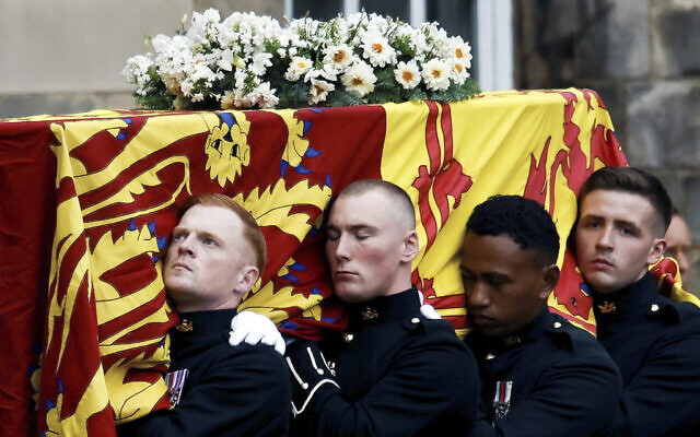 Pallbearers carry the coffin of Queen Elizabeth II, draped with the Royal Standard of Scotland, as it arrives at Holyroodhouse, where it will lie in rest for a day, in Edinburgh, September 11, 2022. (Alkis Konstantinidis/Pool Photo via AP) Pallbearers carry the coffin of Queen Elizabeth II, draped with the Royal Standard of Scotland, as it arrives at Holyroodhouse, where it will lie in rest for a day, in Edinburgh, September 11, 2022. (Alkis Konstantinidis/Pool Photo via AP)
