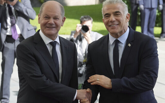 German Chancellor Olaf Scholz, left, welcomes Israeli Prime Minister Yair Lapid, right, for a meeting at the chancellery in Berlin, Germany, Monday, Sept. 12, 2022. (AP Photo/Michael Sohn) German Chancellor Olaf Scholz, left, welcomes Israeli Prime Minister Yair Lapid, right, for a meeting at the chancellery in Berlin, Germany, Monday, Sept. 12, 2022. (AP Photo/Michael Sohn)
