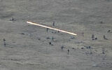 In this image taken from a YouTube footage released by Armenian Defense Ministry, Azerbaijanian servicemen cross the Armenian-Azerbaijani border and approaching the Armenian positions, September 13, 2022. (Armenian Defense Ministry via AP)