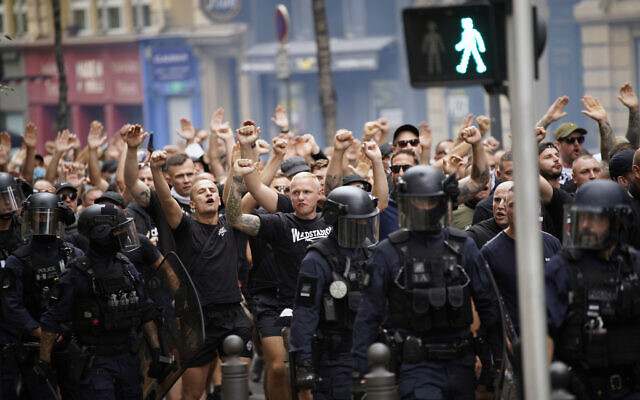 Eintracht Frankfurt fans are escorted by French riot police officers prior to the Champions League soccer match between Olympique de Marseille and Eintracht Frankfurt at the Velodrome stadium in Marseille, France, Sept. 13, 2022. (AP Photo/Daniel Cole) Eintracht Frankfurt fans are escorted by French riot police officers prior to the Champions League soccer match between Olympique de Marseille and Eintracht Frankfurt at the Velodrome stadium in Marseille, France, Sept. 13, 2022. (AP Photo/Daniel Cole)