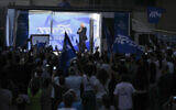 Likud leader Benjamin Netanyahu delivers an election campaign speech from inside a modified delivery truck with a side wall replaced with bulletproof glass, in Beersheba, southern Israel, September 13, 2022. (AP Photo/Ariel Schalit)