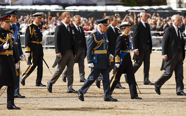 Prince William, second left, Prince Harry, fourth left, King Charles III, center, and Princess Anne follow the coffin of Queen Elizabeth II from Buckingham Palace to Westminster Hall, London, September 14, 2022. (Jeff J Mitchell/Pool via AP)