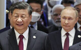 Chinese President Xi Jinping, left, and Russian President Vladimir Putin, walk to attend the Shanghai Cooperation Organization (SCO) summit in Samarkand, Uzbekistan, Friday, Sept. 16, 2022. (Sergei Bobylev, Sputnik, Kremlin Pool Photo via AP)