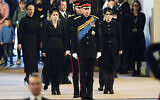 Left to right: Zara Tindall, Lady Louise, Princess Beatrice, Prince William, the prince of Wales, Prince Harry, Princess Eugenie, Viscount James Severn and Peter Phillips attend the vigil of the Queen's grandchildren around the coffin, as it lies in state on the catafalque in Westminster Hall, at the Palace of Westminster, London, Saturday,  Sept. 17, 2022, ahead of her funeral on Monday. (Aaron Chown/Pool Photo via AP)