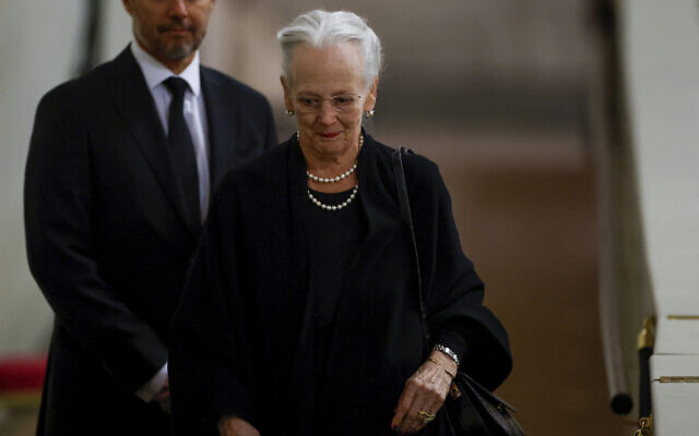 Denmark's Queen Margrethe pays her respect to the coffin of Britain's Queen Elizabeth, following her death, during her lying-in-state at Westminster Hall, in London, Sunday Sept. 18, 2022. (John Sibley/Pool via AP)