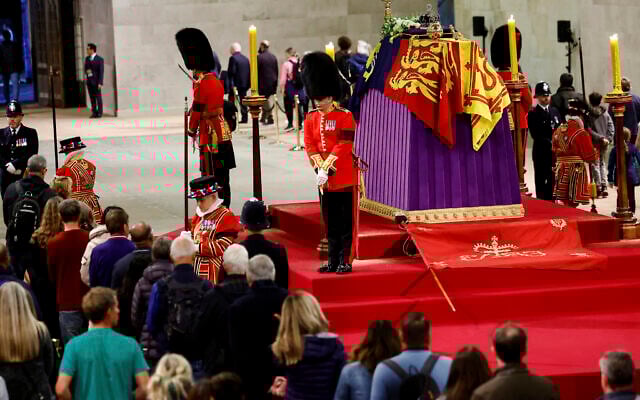 Royal guards stand by the coffin of Britain's Queen Elizabeth II, as members of the public pay their respects, following her death, during her lying-in-state at Westminster Hall, in Westminster Palace, in London, September 18, 2022. (Sarah Meyssonnier/Pool Photo via AP)