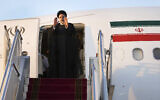 Iranian President Ebrahim Raisi waves to media and officials as he boards his plane while leaving Tehran's Mehrabad airport to New York to attend annual UN General Assembly meeting, September 19, 2022. (Vahid Salemi/AP)