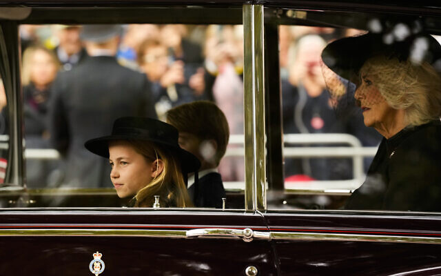 Britain's Prince Charlotte, left, Prince George, background, and Camilla, the Queen Consort, right, arrive by car ahead of the Queen Elizabeth II funeral in central London, Monday, Sept. 19, 2022. The Queen, who died aged 96 on Sept. 8, will be buried at Windsor alongside her late husband, Prince Philip, who died last year. (AP Photo/Andreea Alexandru, Pool) Britain's Prince Charlotte, left, Prince George, background, and Camilla, the Queen Consort, right, arrive by car ahead of the Queen Elizabeth II funeral in central London, Monday, Sept. 19, 2022. The Queen, who died aged 96 on Sept. 8, will be buried at Windsor alongside her late husband, Prince Philip, who died last year. (AP Photo/Andreea Alexandru, Pool)