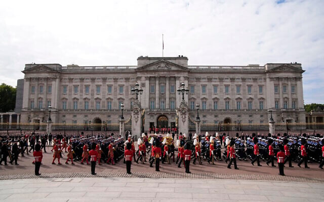 The coffin of Queen Elizabeth II is pulled past Buckingham Palace following her funeral service at Westminster Abbey in central London Monday, Sept. 19, 2022. The Queen, who died aged 96 on Sept. 8, will be buried at Windsor alongside her late husband, Prince Philip, who died last year. (AP Photo/Christophe Ena, Pool) The coffin of Queen Elizabeth II is pulled past Buckingham Palace following her funeral service at Westminster Abbey in central London Monday, Sept. 19, 2022. The Queen, who died aged 96 on Sept. 8, will be buried at Windsor alongside her late husband, Prince Philip, who died last year. (AP Photo/Christophe Ena, Pool)
