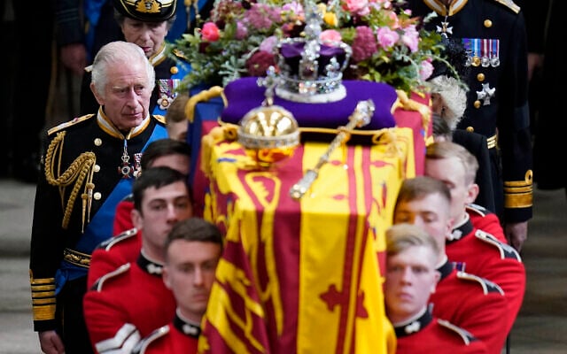 King Charles III and members of the Royal family follow behind the coffin of Queen Elizabeth II, draped in the Royal Standard with the Imperial State Crown and the Sovereign's orb and sceptre, as it is carried out of Westminster Abbey after her State Funeral, in London, Monday Sept. 19, 2022. The Queen, who died aged 96 on Sept. 8, will be buried at Windsor alongside her late husband, Prince Philip, who died last year. (Danny Lawson/Pool Photo via AP) King Charles III and members of the Royal family follow behind the coffin of Queen Elizabeth II, draped in the Royal Standard with the Imperial State Crown and the Sovereign's orb and sceptre, as it is carried out of Westminster Abbey after her State Funeral, in London, Monday Sept. 19, 2022. The Queen, who died aged 96 on Sept. 8, will be buried at Windsor alongside her late husband, Prince Philip, who died last year. (Danny Lawson/Pool Photo via AP)