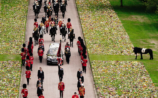 Emma, the monarch's fell pony, right, stands as the Ceremonial Procession of the coffin of Queen Elizabeth II arrives at Windsor Castle for the Committal Service at St George's Chapel, in Windsor, England, Monday, Sept. 19, 2022. (Aaron Chown/Pool photo via AP) Emma, the monarch's fell pony, right, stands as the Ceremonial Procession of the coffin of Queen Elizabeth II arrives at Windsor Castle for the Committal Service at St George's Chapel, in Windsor, England, Monday, Sept. 19, 2022. (Aaron Chown/Pool photo via AP)