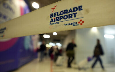 Passengers from the Moscow-Belgrade flight, operated by Air Serbia, pass through the airport building in Belgrade, Serbia, Sept. 21, 2022. (Darko Vojinovic/AP)