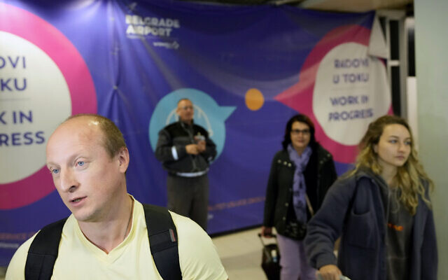 Vladimir, a passenger from the Moscow-Belgrade flight operated by Air Serbia, speaks to the media at the airport in Belgrade, Serbia, Wednesday, Sept. 21, 2022. Large numbers of Russians rushed to book one-way tickets out of the country while they still could after Russian President Vladimir Putin announced a partial mobilization of military reservists for the war in Ukraine. (AP Photo/Darko Vojinovic) Vladimir, a passenger from the Moscow-Belgrade flight operated by Air Serbia, speaks to the media at the airport in Belgrade, Serbia, Wednesday, Sept. 21, 2022. Large numbers of Russians rushed to book one-way tickets out of the country while they still could after Russian President Vladimir Putin announced a partial mobilization of military reservists for the war in Ukraine. (AP Photo/Darko Vojinovic)