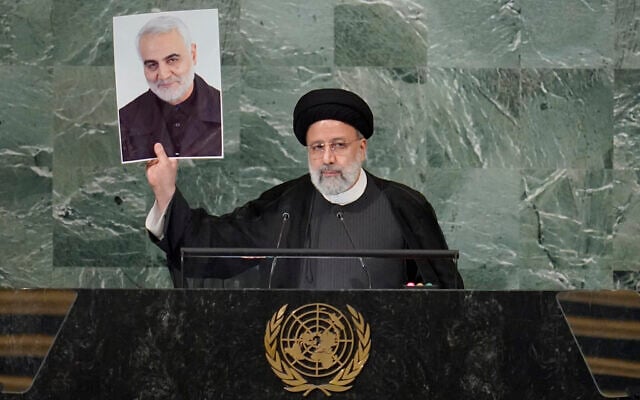 President of Iran Ebrahim Raisi holds up a photo of assassinated Iranian Gen. Qassem Soleimani as he addresses the 77th session of the United Nations General Assembly, at UN headquarters, September 21, 2022. (Mary Altaffer/AP) President of Iran Ebrahim Raisi holds up a photo of assassinated Iranian Gen. Qassem Soleimani as he addresses the 77th session of the United Nations General Assembly, at UN headquarters, September 21, 2022. (Mary Altaffer/AP)