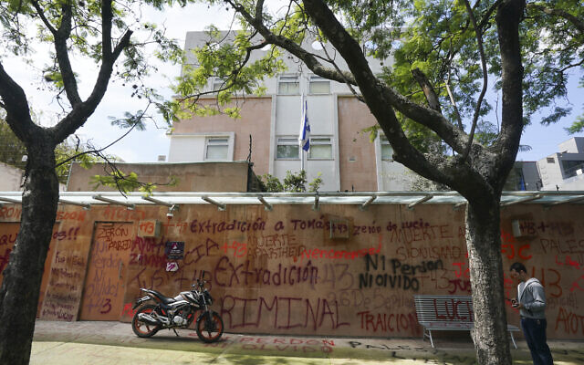 A motorcycle sits parked in front of Israel's embassy that was defaced by demonstrators demanding the extradition of the former director of Mexico’s Criminal Investigation Agency, Tomas Zeron, who is accused of torture, forced disappearances and judicial misconduct in the case of the 43 missing students of Ayotzinapa, in Mexico City, Wednesday, September 21, 2022. (AP Photo/Fernando Llano) A motorcycle sits parked in front of Israel's embassy that was defaced by demonstrators demanding the extradition of the former director of Mexico’s Criminal Investigation Agency, Tomas Zeron, who is accused of torture, forced disappearances and judicial misconduct in the case of the 43 missing students of Ayotzinapa, in Mexico City, Wednesday, September 21, 2022. (AP Photo/Fernando Llano)