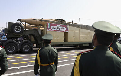 Emad missiles are carried during a military parade commemorating the anniversary of the start of the 1980-88 Iraq-Iran war, in front of the shrine of the late revolutionary founder Ayatollah Khomeini, just outside Tehran, Iran, September 22, 2022. (AP Photo/Vahid Salemi)