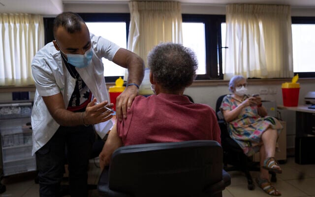 A man receives the fifth Pfizer-BioNTech COVID-19 vaccine from medical staff at Clalit Health services in Tel Aviv, Israel, September 22, 2022. (AP Photo/Oded Balilty) A man receives the fifth Pfizer-BioNTech COVID-19 vaccine from medical staff at Clalit Health services in Tel Aviv, Israel, September 22, 2022. (AP Photo/Oded Balilty)