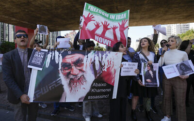 Iranians who live in Brazil protest against the death of Iranian woman Mahsa Amini, who died in Iran while in police custody, in Sao Paulo, Brazil, Friday, September 23, 2022. (AP/Andre Penner)