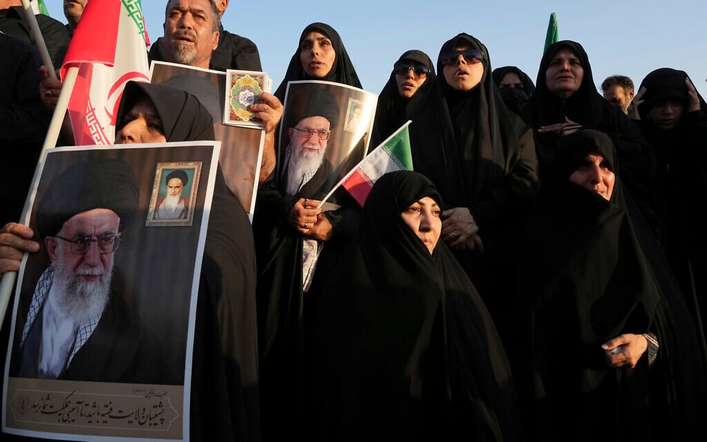 Iranian pro-government demonstrators hold posters of the Supreme Leader Ayatollah Ali Khamenei during their rally condemning recent anti-government protests over the death of Mahsa Amini, a 22-year-old woman who had been detained by the nation's morality police, in Tehran, Iran, Sunday, Sept. 25, 2022. (AP Photo/Vahid Salemi, File) Iranian pro-government demonstrators hold posters of the Supreme Leader Ayatollah Ali Khamenei during their rally condemning recent anti-government protests over the death of Mahsa Amini, a 22-year-old woman who had been detained by the nation's morality police, in Tehran, Iran, Sunday, Sept. 25, 2022. (AP Photo/Vahid Salemi, File)