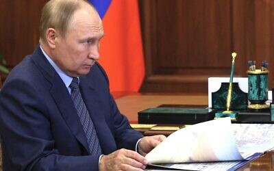 Russian President Vladimir Putin listens to Volgograd Region Governor Andrei Bocharov during their meeting in Moscow, Russia, Wednesday, Sept. 28, 2022. (Gavriil Grigorov, Sputnik, Kremlin Pool Photo via AP)