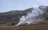 Smoke billows in the village of Zrgoiz, near Sulaimaniyah, Iraq, where the bases of several Iranian opposition groups are located, September 28, 2022. (AP PhotoAla Hoshyar, Metrography)