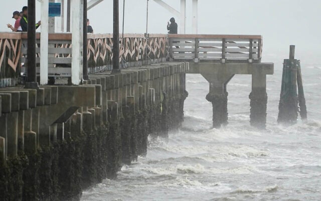 Waves crash along the Ballast Point Pier ahead of Hurricane Ian, Sept. 28, 2022, in Tampa, Florida. (AP Photo/Chris O'Meara) Waves crash along the Ballast Point Pier ahead of Hurricane Ian, Sept. 28, 2022, in Tampa, Florida. (AP Photo/Chris O'Meara)