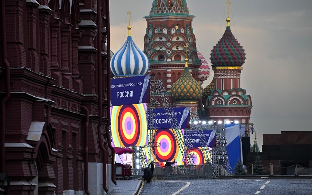 People make preparations for a concert at the Red Square, with constructions reading the words ''Donetsk, Luhansk, Zaporizhzhia, Kherson, Russia'', and the St. Basil's Cathedral and Lenin Mausoleum on the background, in Moscow, Russia, September 29, 2022. (AP Photo/Alexander Zemlianichenko) People make preparations for a concert at the Red Square, with constructions reading the words ''Donetsk, Luhansk, Zaporizhzhia, Kherson, Russia'', and the St. Basil's Cathedral and Lenin Mausoleum on the background, in Moscow, Russia, September 29, 2022. (AP Photo/Alexander Zemlianichenko)