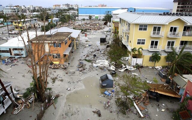 Damaged homes and businesses are seen after Hurricane Ian, in Fort Myers Beach, Florida, September 29, 2022, (Douglas R. Clifford/Tampa Bay Times via AP) Damaged homes and businesses are seen after Hurricane Ian, in Fort Myers Beach, Florida, September 29, 2022, (Douglas R. Clifford/Tampa Bay Times via AP)