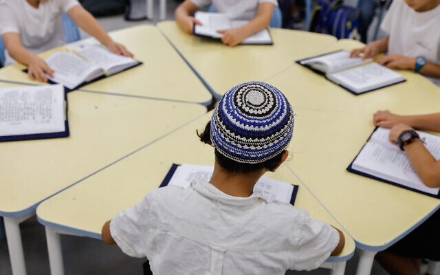 Illustrative: Israeli students seen on the first day of school at a school in Jerusalem, on September 1, 2022. (Olivier Fitoussi/Flash90) Illustrative: Israeli students seen on the first day of school at a school in Jerusalem, on September 1, 2022. (Olivier Fitoussi/Flash90)