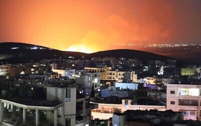 File: A fire is seen after an alleged airstrike near the Syrian city of Masyaf, on August 25, 2022. (Social media: used in accordance with Clause 27a of the Copyright Law)