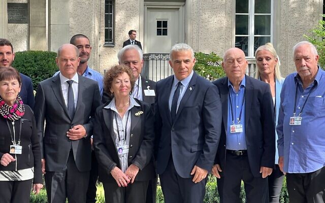 Prime Minister Yair Lapid (4R) and German Chancellor Olaf Scholz (3L) meet with Holocaust survivors and family members at the the House of the Wannsee Conference outside of Berlin on September 12, 2022 (Lazar Berman/Times of Israel) Prime Minister Yair Lapid (4R) and German Chancellor Olaf Scholz (3L) meet with Holocaust survivors and family members at the the House of the Wannsee Conference outside of Berlin on September 12, 2022 (Lazar Berman/Times of Israel)