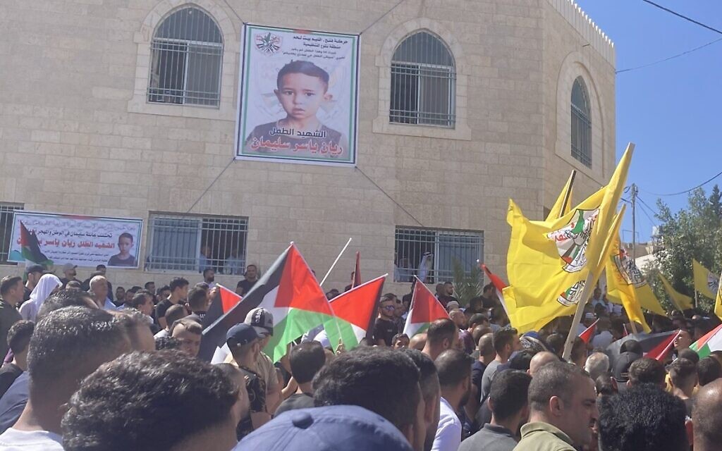 Mourners carry the body of Rayan Suleiman, 7, at a funeral in Tuqu, West Bank, on September 30, 2022. (Jack Mukand/Times of Israel) Mourners carry the body of Rayan Suleiman, 7, at a funeral in Tuqu, West Bank, on September 30, 2022. (Jack Mukand/Times of Israel)