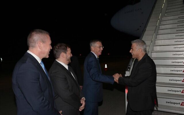 Prime Minister Yair Lapid (right) is greeted by (right to left) Ambassador to the US Michael Herzog, Consul-General in New York Asaf Zamir, and UN Ambassador Gilad Erdan, on the tarmac at JFK airport in New York on September 20, 2022. (Avi Ohayon/GPO) Prime Minister Yair Lapid (right) is greeted by (right to left) Ambassador to the US Michael Herzog, Consul-General in New York Asaf Zamir, and UN Ambassador Gilad Erdan, on the tarmac at JFK airport in New York on September 20, 2022. (Avi Ohayon/GPO)