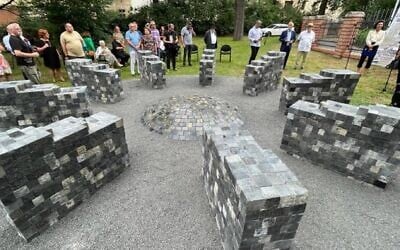 Members of the Jewish community of Prague, the Czech Republic, attend the unveiling of a monument made of Jewish headstones at a local Jewish cemetery, September 7, 2022. (Courtesy of the Jewish Community of Prague via JTA)