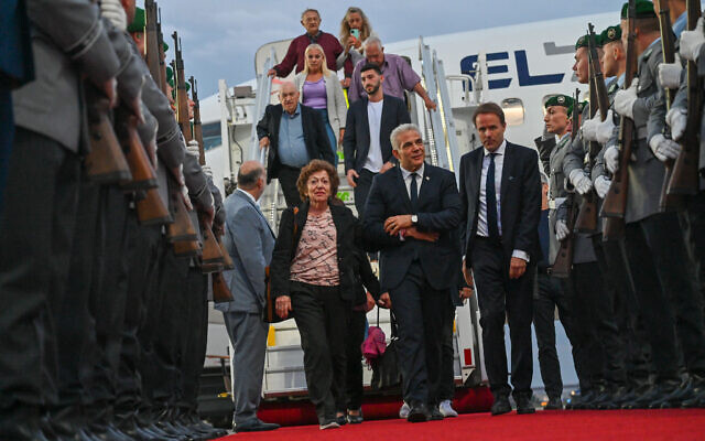 Prime Minister Yair Lapid is greeted at the airport in Berlin with Ukraine-born Holocaust survivor Shoshana Trister on September 11, 2022. (Kobi Gideon/GPO) Prime Minister Yair Lapid is greeted at the airport in Berlin with Ukraine-born Holocaust survivor Shoshana Trister on September 11, 2022. (Kobi Gideon/GPO)