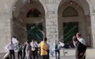 A screenshot from a video released by police on September 26, 2022, shows fireworks being shot off during scuffles between Palestinians and officers at the Temple Mount in Jerusalem's Old City. (Twitter screenshot, used in accordance with Clause 27a of the Copyright Law)