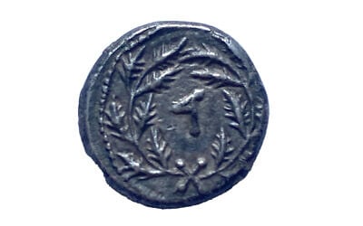 A rare quarter shekel silver coin, minted in 69 CE, that was handed over to Israeli authorities in New York, September 12, 2022. (Israel Antiquities Authority)