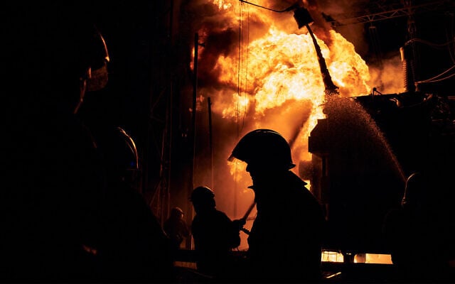 Ukrainian firefighters put out a fire after a Russian rocket attack hit an electric power station in Kharkiv, Ukraine, September 11, 2022. (AP Photo/Kostiantyn Liberov) Ukrainian firefighters put out a fire after a Russian rocket attack hit an electric power station in Kharkiv, Ukraine, September 11, 2022. (AP Photo/Kostiantyn Liberov)