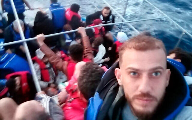 Jihad Michlawi, right, takes a selfie on board an overcrowded migrant boat carrying about 150 Lebanese, Syrians, and Palestinians in the Mediterranean Sea, Lebanon, September 21, 2022. (Courtesy of Jihad Michlawi via AP) Jihad Michlawi, right, takes a selfie on board an overcrowded migrant boat carrying about 150 Lebanese, Syrians, and Palestinians in the Mediterranean Sea, Lebanon, September 21, 2022. (Courtesy of Jihad Michlawi via AP)