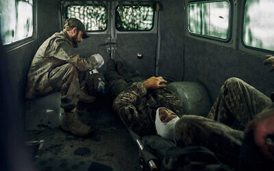 Wounded Ukrainian soldiers in a vehicle in the freed territory of the Kharkiv region, Ukraine, September 12, 2022. (AP Photo/Kostiantyn Liberov)