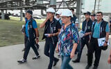 International Atomic Energy Agency (IAEA) director Rafael Grossi, the mission leader, center in white helmet, and IAEA members walk while inspecting the Zaporizhzhia Nuclear Power Plant in Enerhodar, southeastern Ukraine, September 1, 2022. (Russian Defense Ministry Press Service via AP)