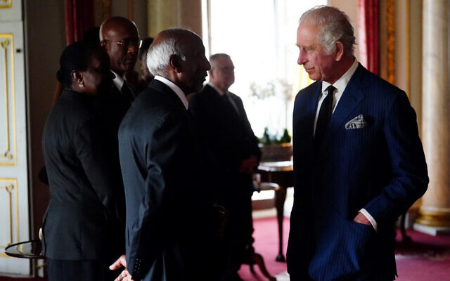 Britain's King Charles III (R) during a reception with Realm High Commissioners and their spouses in Buckingham Palace, London, on September 11, 2022. (Victoria Jones/Pool/AFP) Britain's King Charles III (R) during a reception with Realm High Commissioners and their spouses in Buckingham Palace, London, on September 11, 2022. (Victoria Jones/Pool/AFP)