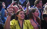 Supporters of the Sweden Democrats cheer during the Party's election night in Nacka, near Stockholm, after exit polls were released during the general elections in Sweden on September 11, 2022. (Jonathan Nackstrand/AFP)
