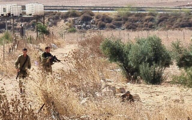 Israeli troops arrest a Palestinian man who allegedly attempted to snatch a soldier's gun near Beit Furik in the northern West Bank, September 7, 2022. (Social media) Israeli troops arrest a Palestinian man who allegedly attempted to snatch a soldier's gun near Beit Furik in the northern West Bank, September 7, 2022. (Social media)
