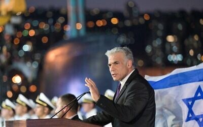 Prime Minister Yair Lapid speaks during a Navy officers graduation ceremony at the Haifa naval base, September 7, 2022. (Kobi Gideon/GPO)