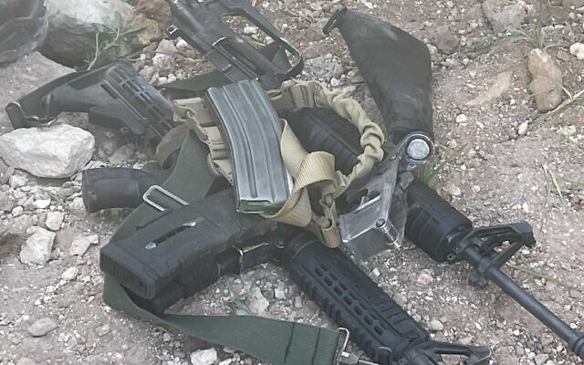 Assault rifles seized by troops from Palestinians allegedly responsible for shooting at Efrat in the West Bank in July, in an image published by the military on September 22, 2022 (Israel Defense Forces) Assault rifles seized by troops from Palestinians allegedly responsible for shooting at Efrat in the West Bank in July, in an image published by the military on September 22, 2022 (Israel Defense Forces)