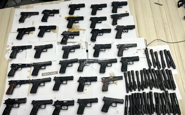 Weapons seized by security forces in the Jordan Valley, after an alleged gun-smuggling attempt over the border with Jordan on September 24, 2022. (Israel Defense Forces) Weapons seized by security forces in the Jordan Valley, after an alleged gun-smuggling attempt over the border with Jordan on September 24, 2022. (Israel Defense Forces)