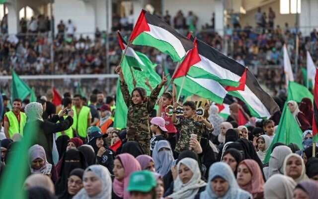 Supporters of the Palestinian Hamas terror group attend a rally in support of Jerusalem's Al-Aqsa Mosque in Gaza City on October 1, 2022. (Mahmud HAMS/AFP) Supporters of the Palestinian Hamas terror group attend a rally in support of Jerusalem's Al-Aqsa Mosque in Gaza City on October 1, 2022. (Mahmud HAMS/AFP)